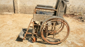 abandoned-old-wheelchair-26556954